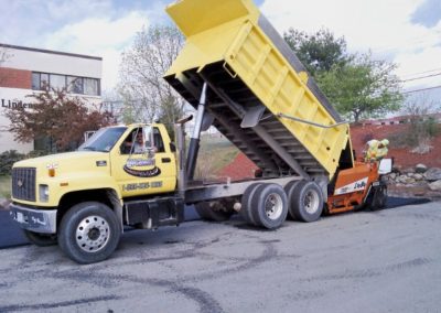 yellow truck unloading material