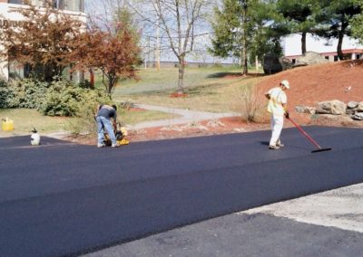 workers creating asphalt
